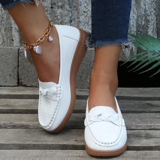 Pair of versatile women's walking loafers, combining slip-on convenience with supportive, ergonomic design.