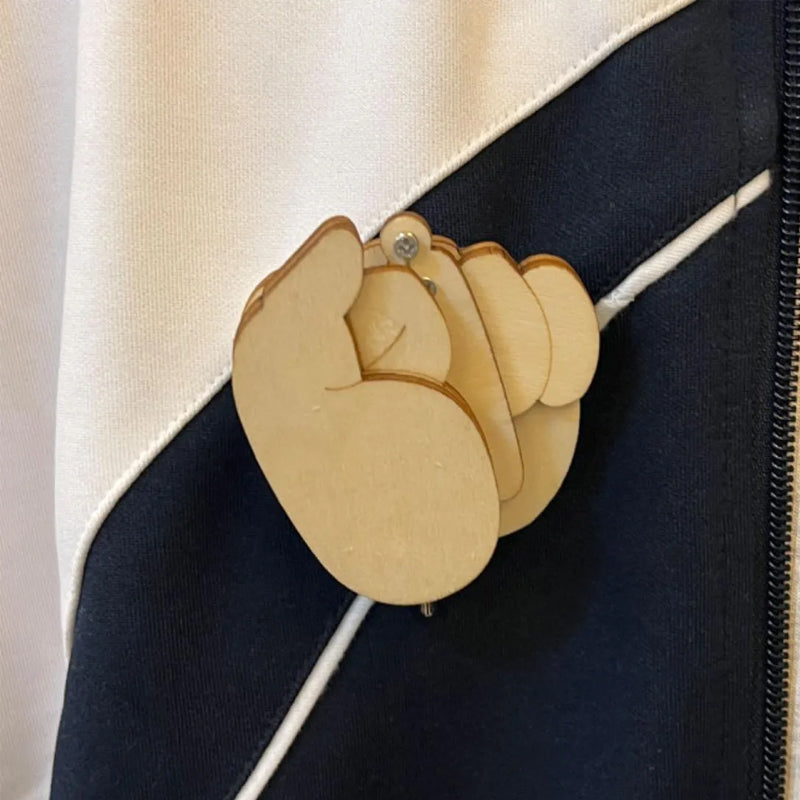 Wooden flippable middle finger brooch, a humorous accessory and gag gift for adults, novelty pin.