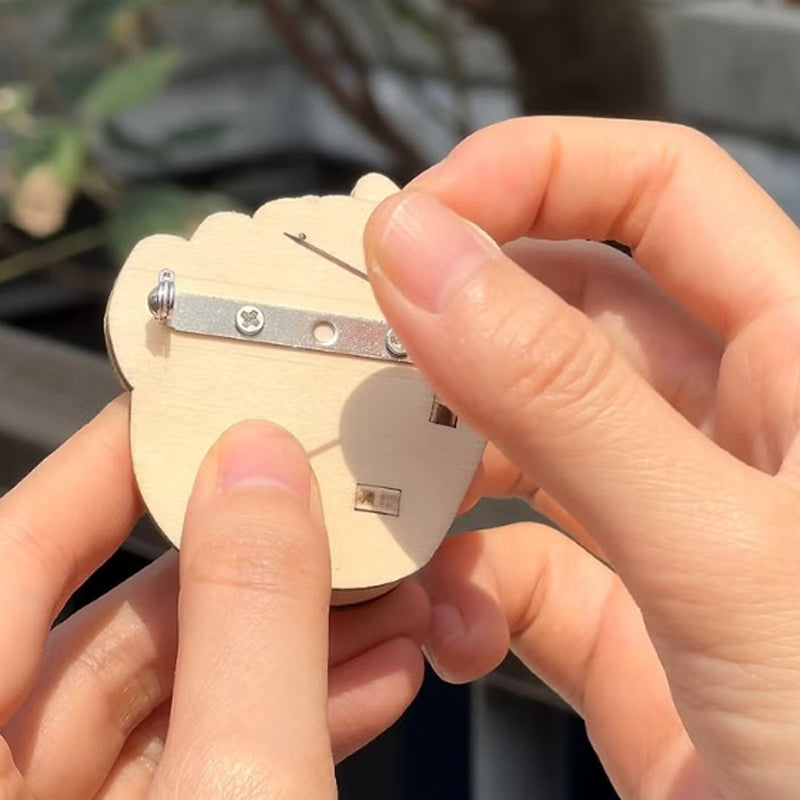 Stress relief novelty pin: humorous wooden flippable finger brooch for adults, a funny accessory.