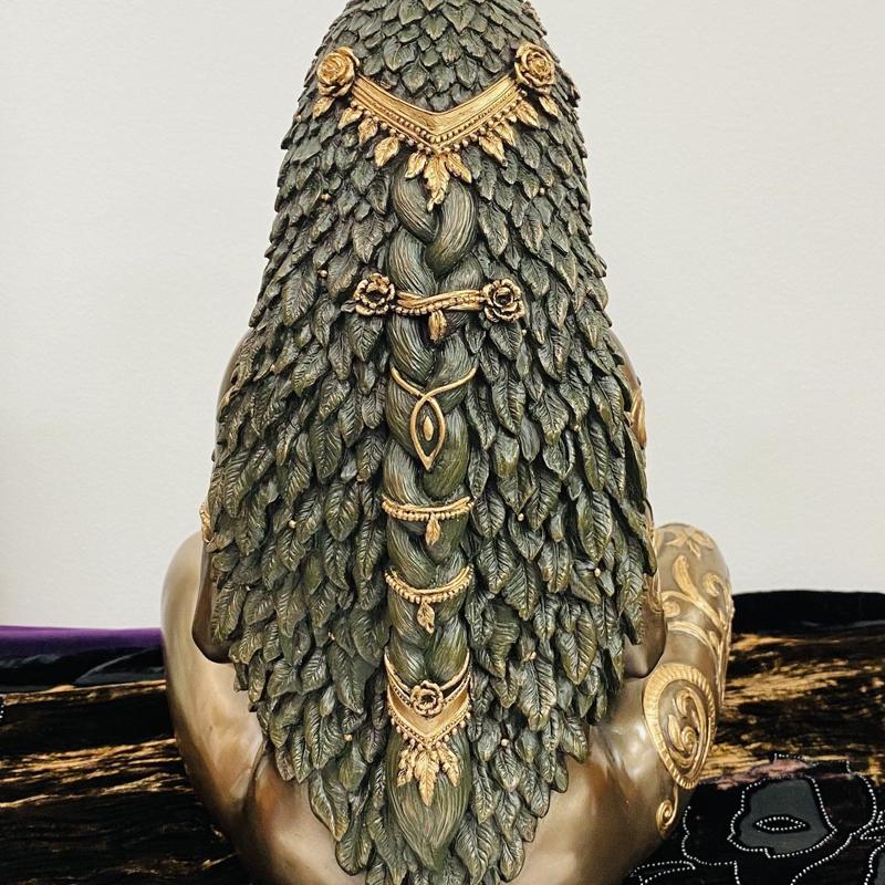 Resin Gaia Earth Mother figurine with flowing hair and botanicals, ideal for nature-inspired home decor