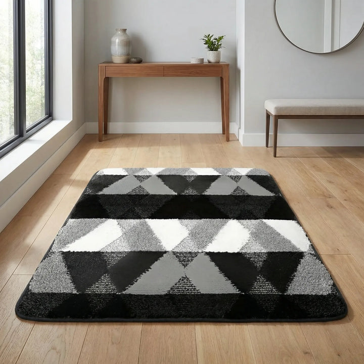 Decorative geometric entryway mat with wave pattern. Non-slip & absorbent for front door or kitchen.