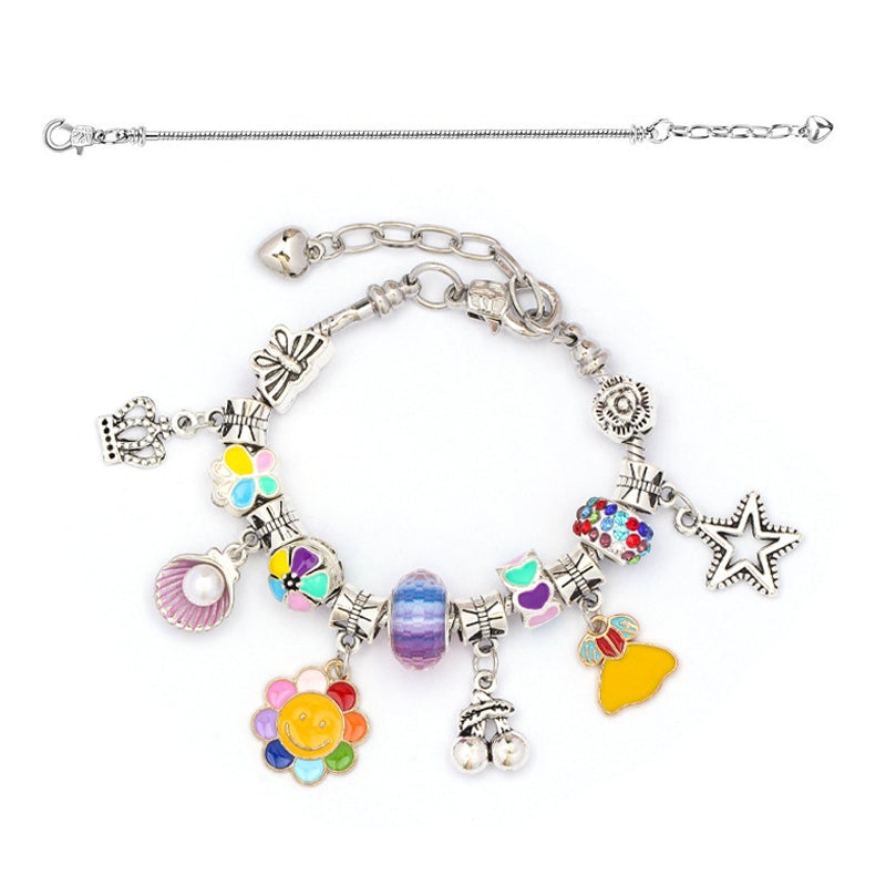 Finished charm bracelet, handmade with heart and star charms, from the girls' jewelry making kit.