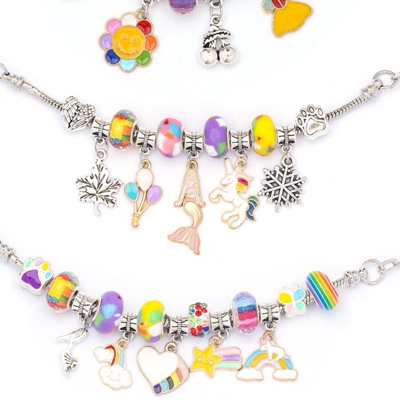 Girls' DIY Charm Bracelet Making Kit box with contents spilling out; beads, charms, and instructions.