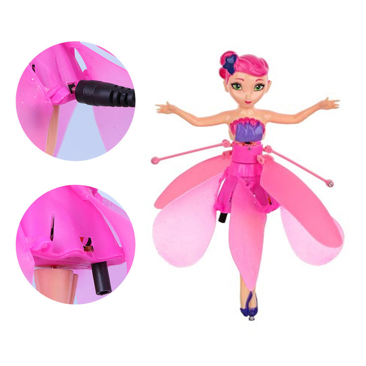 Young girl happily playing with a magical Flying Fairy Doll, captivating kids toy with induction