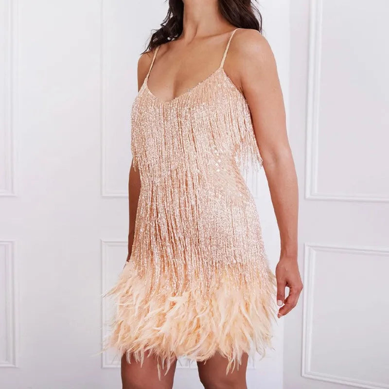 Luxurious women's sequin mini dress featuring playful fringe and feather accents. Sleeveless V-neck party wear.