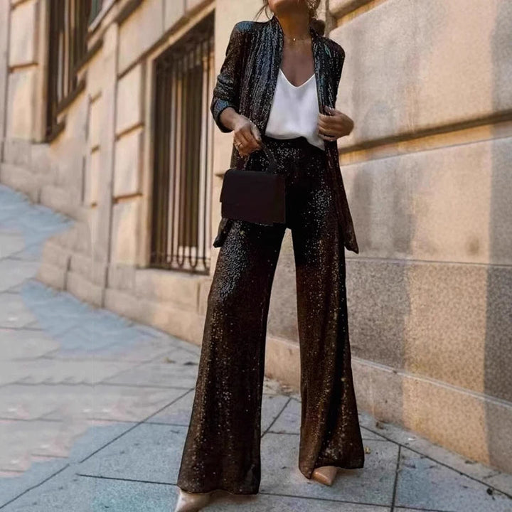 Glamorous women's sequin two-piece set with high-waisted pants, perfect for evening parties & special occasions.