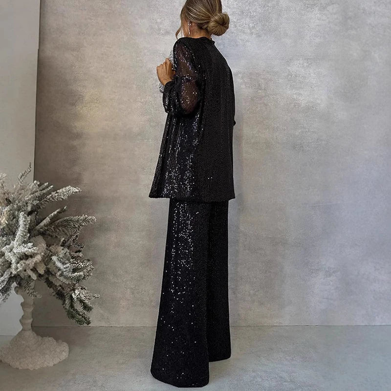 Chic women's sparkling sequin co-ord set featuring a top and high-waisted trousers for party wear.