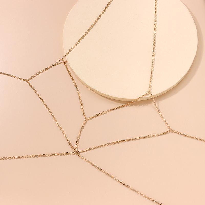 Fashionable gold body chain, adding sparkle to any women's outfit