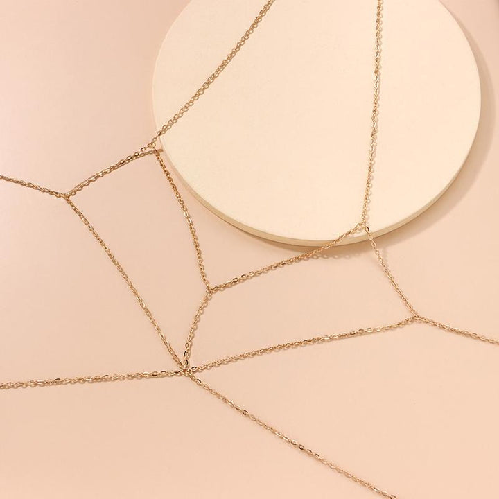 Fashionable gold body chain, adding sparkle to any women's outfit