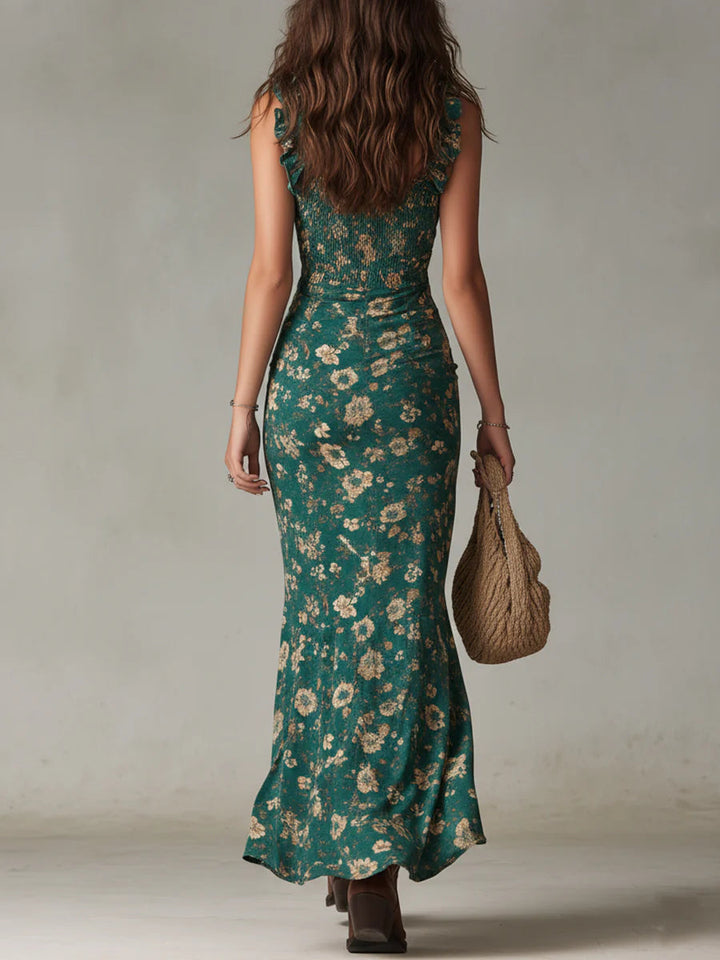 Women's green floral print boho maxi sundress with smocked bodice & ruffle trim, a stylish summer vacation dress.