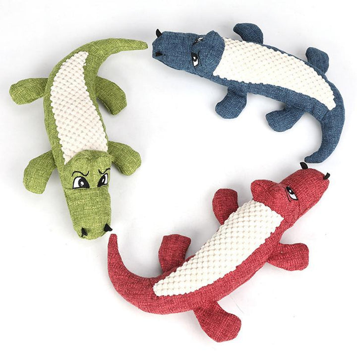Detailed view of the crocodile toy's texture, a soft yet durable squeaking plush for dogs, pet supplies
