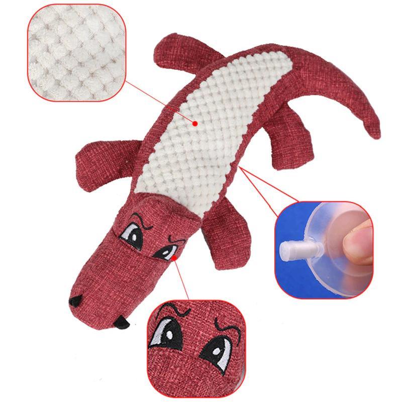 Small dog breed chewing on the green Pet Crocodile Squeaking Chew Toy, perfect size dog supplies