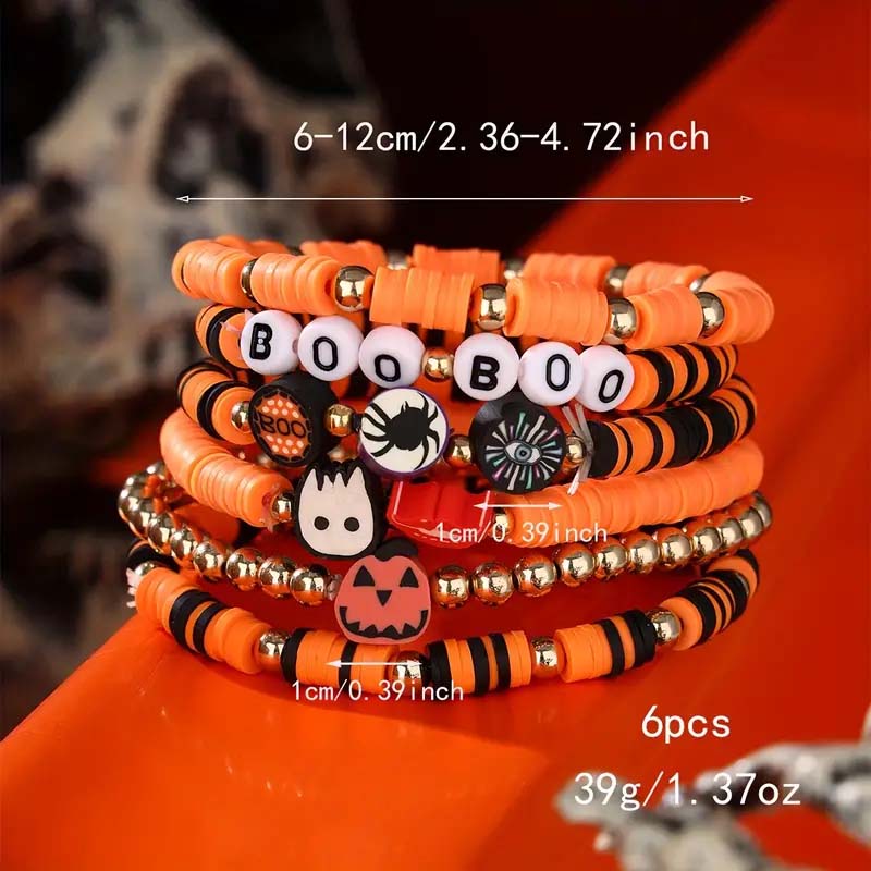 Overhead view of the complete Halloween beaded bracelet set with various charms.