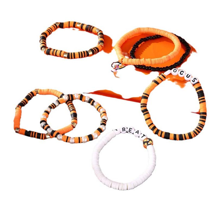 Spooky yet cute: a set of unisex Halloween bracelets with ghost and pumpkin details.
