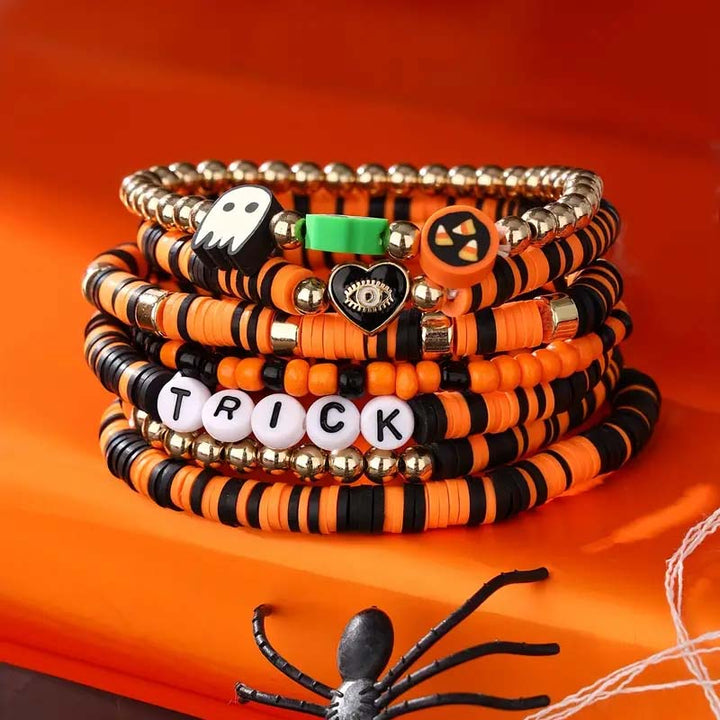 Unisex Halloween accessory: a set of beaded clay bracelets with fun spooky charms.