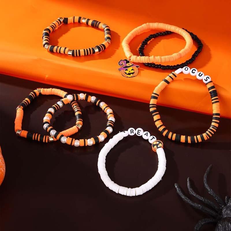 Multiple beaded bracelets for Halloween, showcasing ghost, pumpkin, and black/orange beads.
