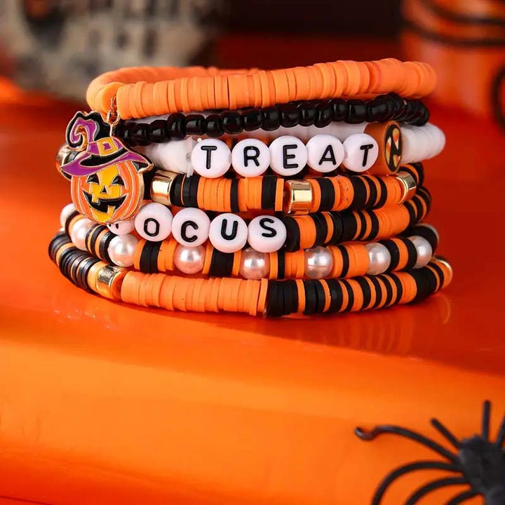 A stack of festive Halloween bracelets, perfect as a spooky gift, suitable for all genders.