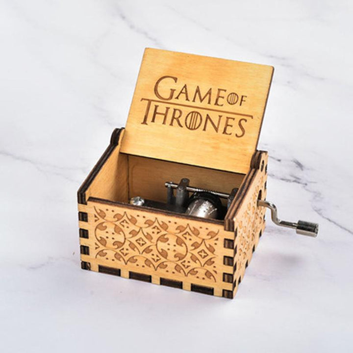 Decor item: Small wooden melody box, hand-cranked for a personal touch, ideal for shelves
