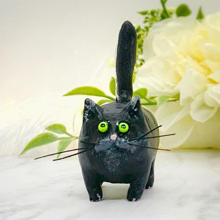 Charming hand-sculpted miniature cat, ready to adorn any shelf or desk as a cute decor.
