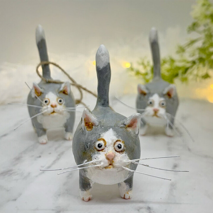 Exquisite hand-painted miniature cat sculpture, a perfect blend of art and animal theme.
