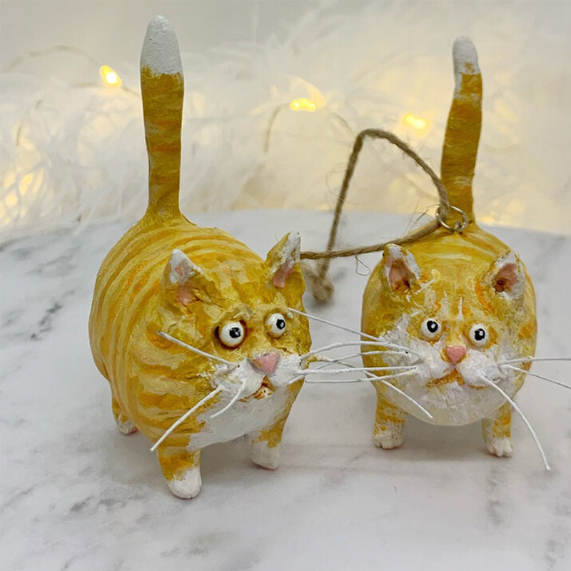 Handmade miniature feline figurine, an artistic decor item with intricate hand-painted features.