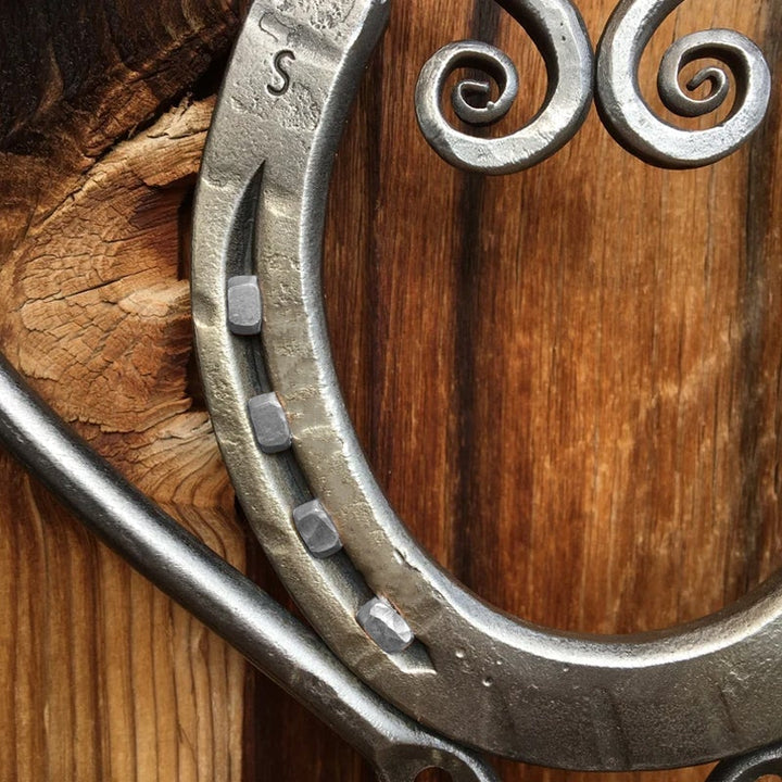 Beautiful heart-shaped metal wind chime, designed for tranquil outdoor home and garden decor.