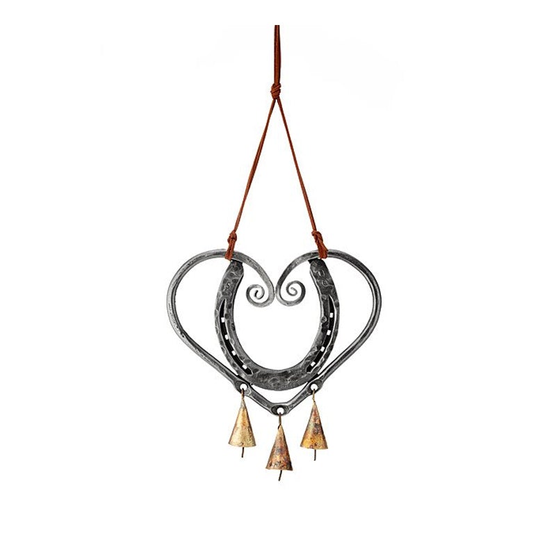 Artistic heart-shaped metal wind chime, creating soothing sounds and romantic garden ambiance.