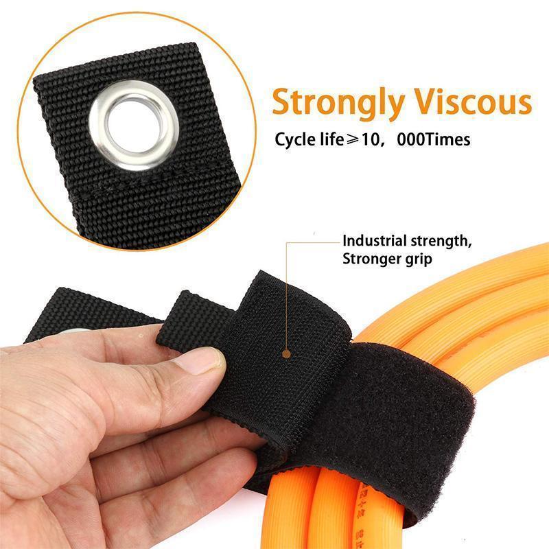 Close-up of a robust nylon cable organizer strap, showcasing the strong velcro and durable material.