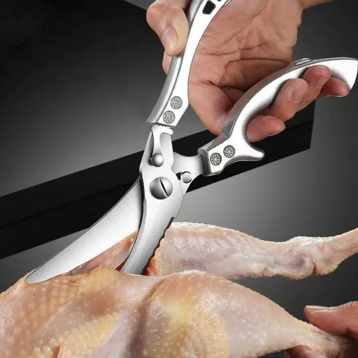 Heavy-duty stainless steel kitchen shears for effortless cutting during food prep & cooking.