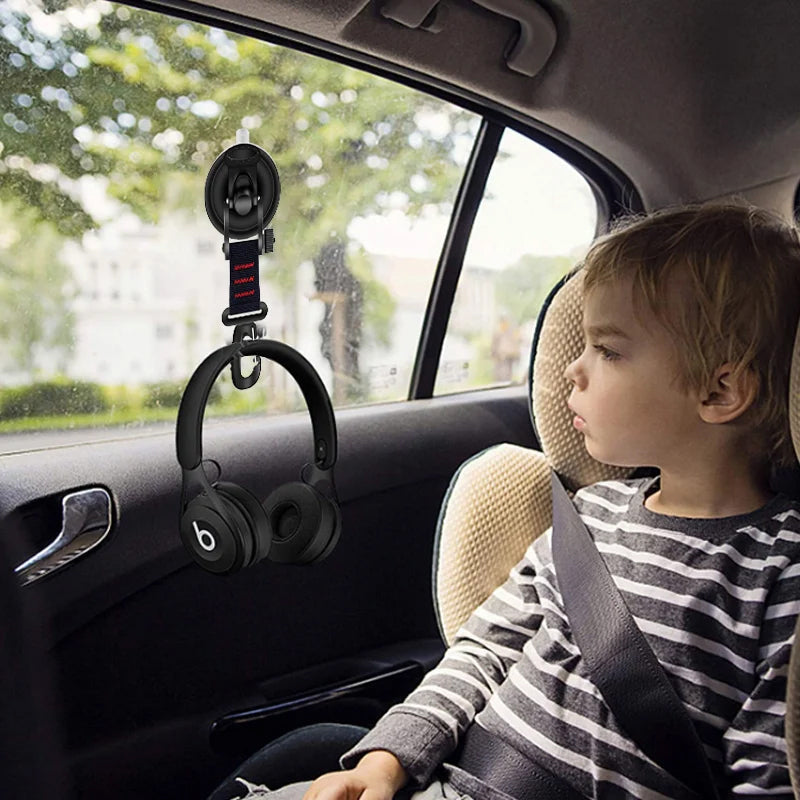 Car camping setup showing a suction cup hook holding gear, a practical travel accessory.
