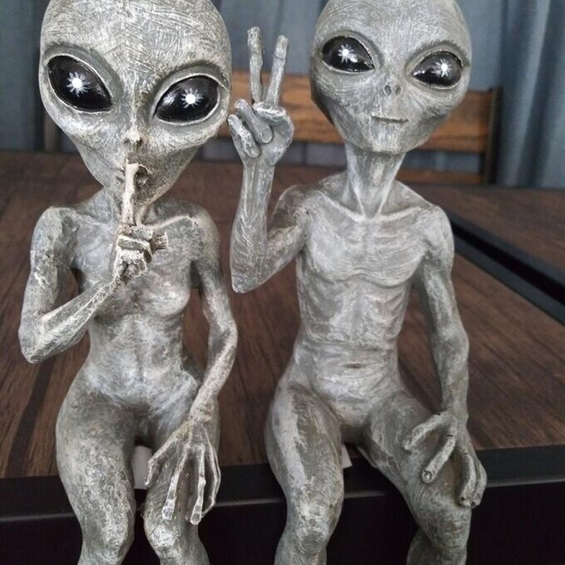 Unisex alien garden statue adds a quirky touch to any garden or outdoor space