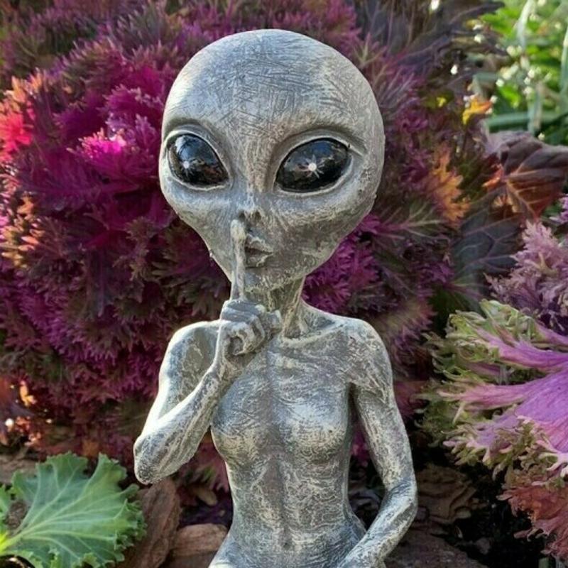 Playful alien garden statue, ideal for adding a humorous element to your outdoor landscape