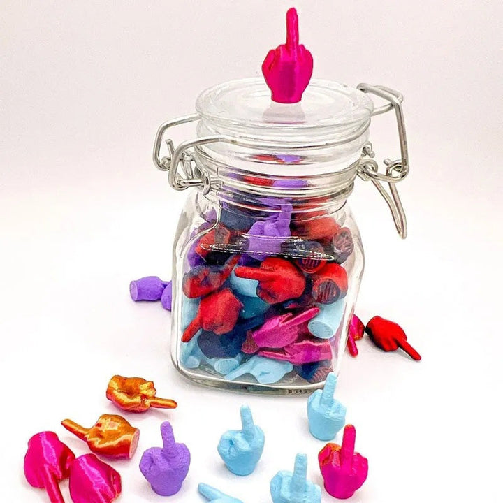 Humorous desktop decor jar filled with numerous white middle finger sculptures, novelty office gag gift