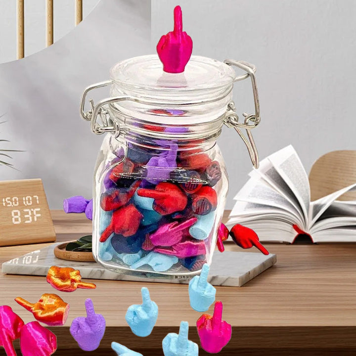Novelty desk accessory, transparent jar holding an array of white middle finger sculptures for humor.