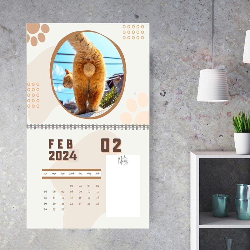 Novelty wall calendar featuring humorous feline artistic expressions, a great gag gift idea