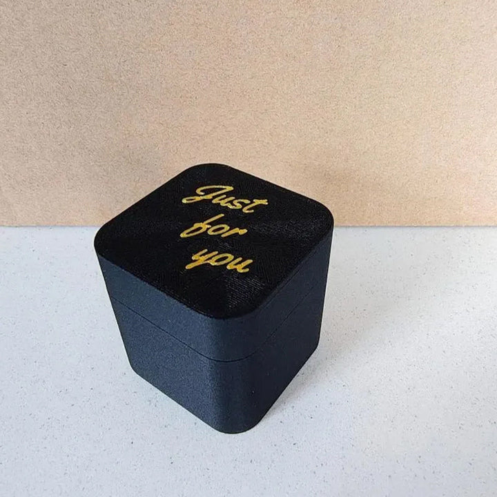 Black and gold durable plastic gag gift box, 125 characters