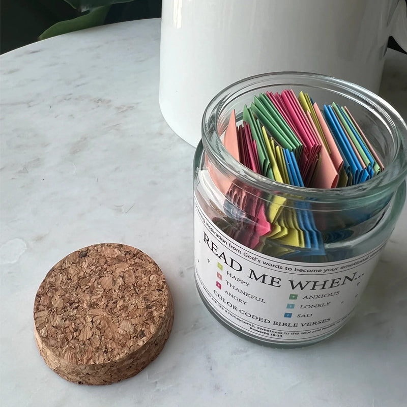 Gift-ready 'Hope Jar' with ribbon and tag, containing Bible verses for inspirational gifting.
