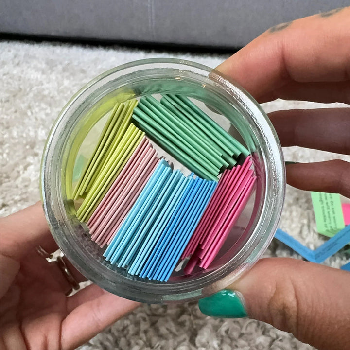 Person holding a 'Hope Jar' filled with Bible verses, a symbol of faith and encouragement.