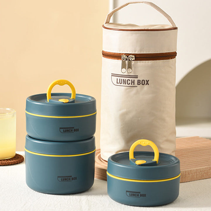 Insulated stainless steel lunch container set next to fresh ingredients, highlighting meal prep benefits