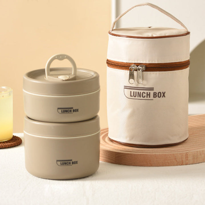 Compact insulated stainless steel lunchbox, easily fitting into a bag for portable food storage
