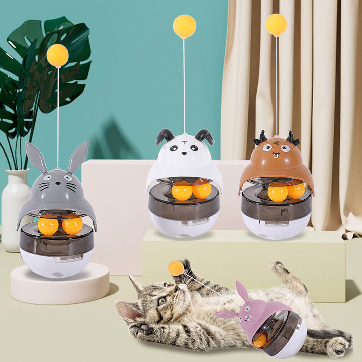 Interactive cat treat dispenser, tumbler design, with treats visible, enriching play