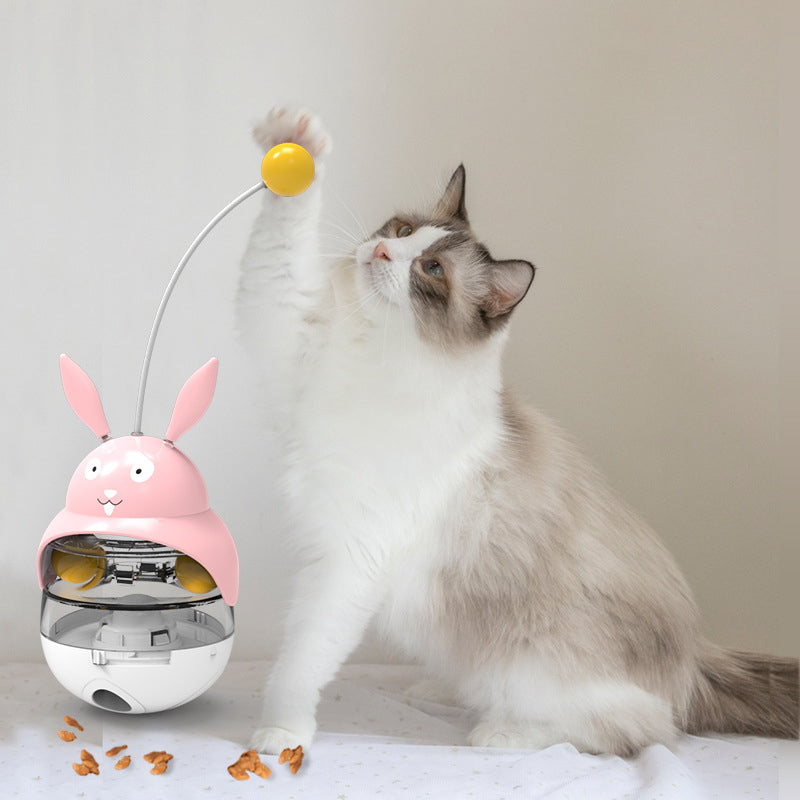 Tumbler cat toy dispenses treats, encouraging active play and mental stimulation