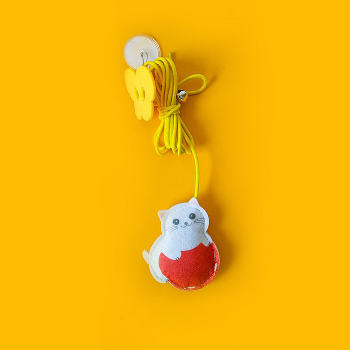 Interactive cat toy in motion, demonstrating its elastic bounce for engaging and enriching feline playtime