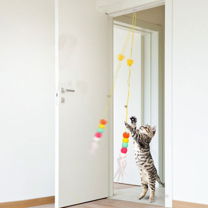 Feline engaging with the hanging cat toy, showcasing its ability to provide stimulating playtime and enrichment