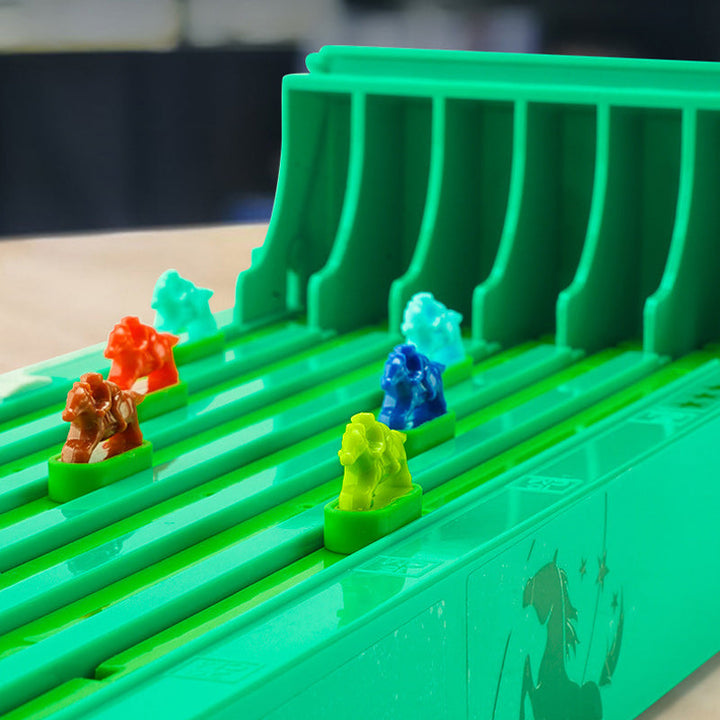 Detailed shot of the game board track, showing different race lanes for horse racing fun