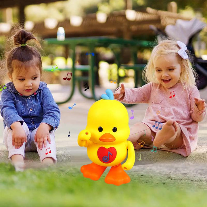 The interactive musical duck toy illuminated in a dark room, highlighting light effects.