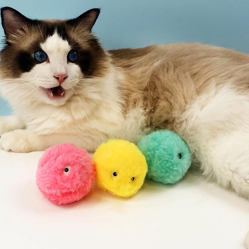 Interactive pet play ball for cats with catnip, stimulating playful instincts