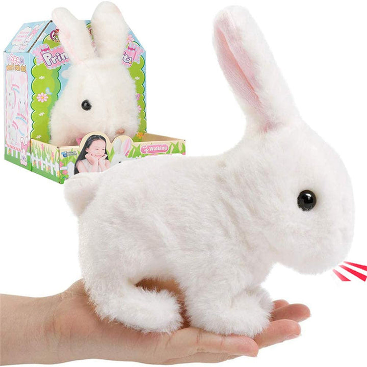 Close-up of a soft, white plush bunny, an interactive walking animal toy for children