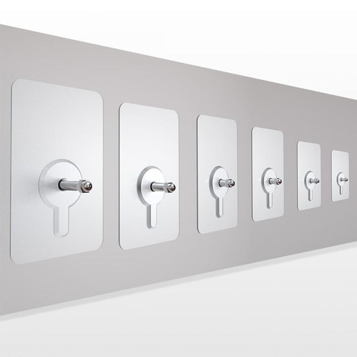 Reusable, no-drill adhesive wall hanger in a bathroom setting, holding an accessory