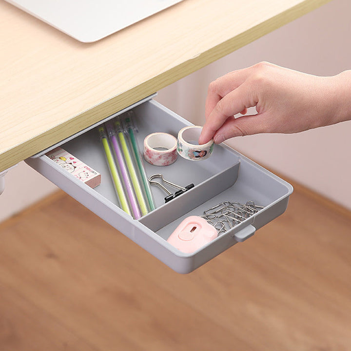 Gadget storage under desk, invisible drawer organizer, keeping electronics hidden but accessible.